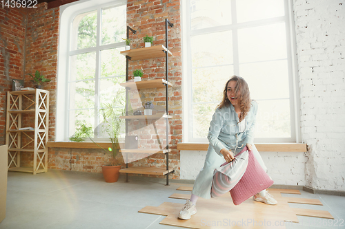 Image of Young couple moved to a new house or apartment