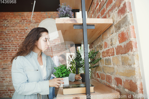 Image of Young couple moved to a new house or apartment