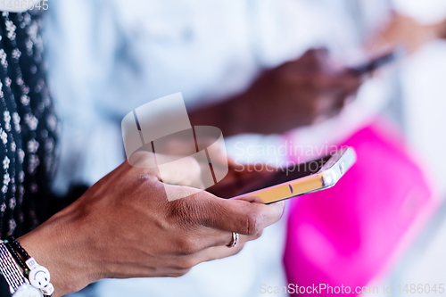 Image of african students group using smart phones