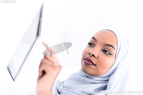 Image of african woman using smart home screen