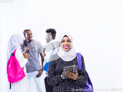 Image of muslim female student with group of friends