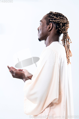 Image of african man pray to Allah