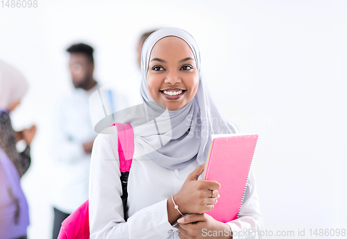 Image of portrait of african female student with group of friends