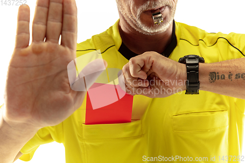 Image of Football referee showing a red card to a displeased player isolated on white background