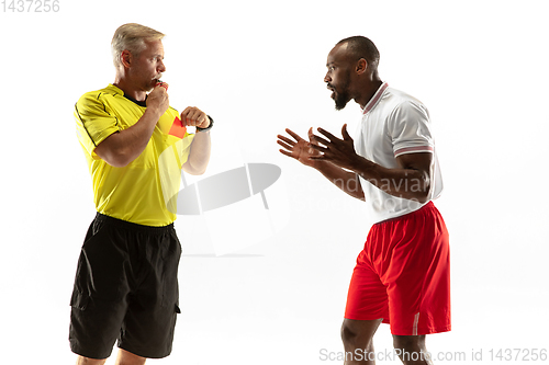 Image of Football referee showing a red card to a displeased player isolated on white background