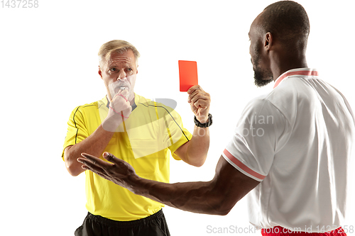 Image of Football referee showing a red card to a displeased player isolated on white background