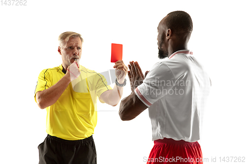 Image of Football referee showing a red card to a displeased player isolated on white background