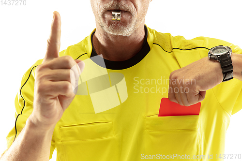 Image of Football referee showing a red card to a displeased player isolated on white background