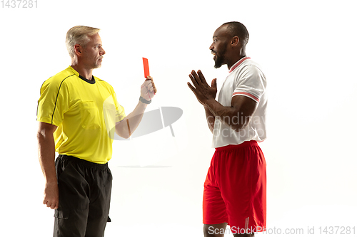 Image of Football referee showing a red card to a displeased player isolated on white background