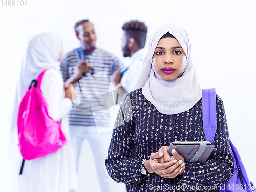 Image of muslim female student with group of friends