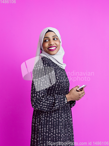 Image of modern muslim business woman using smartphone