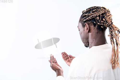 Image of african man pray to Allah