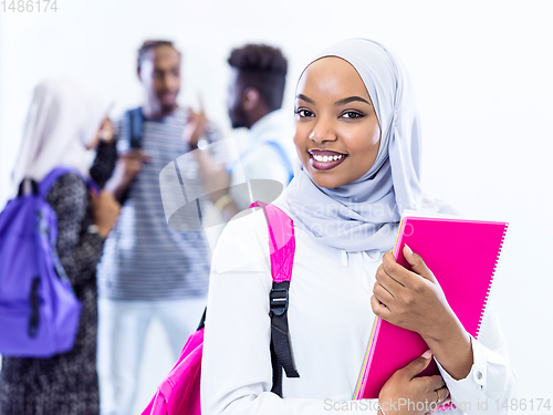 Image of portrait of african female student with group of friends