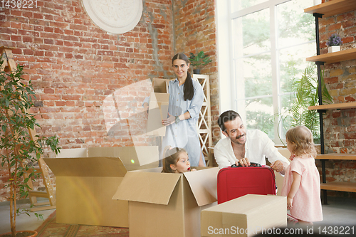 Image of Adult family moved to a new house or apartment