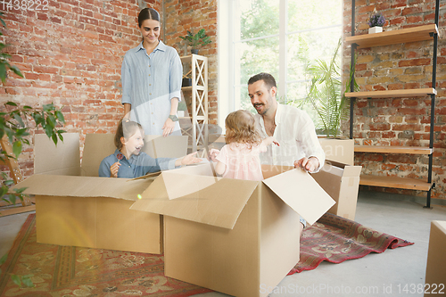 Image of Adult family moved to a new house or apartment