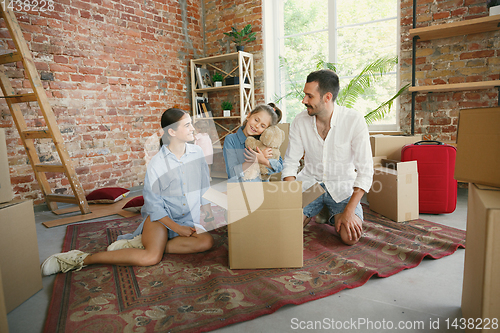 Image of Adult family moved to a new house or apartment