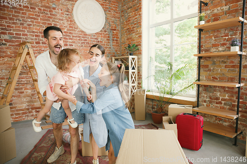 Image of Adult family moved to a new house or apartment