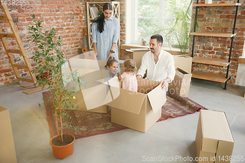 Image of Adult family moved to a new house or apartment