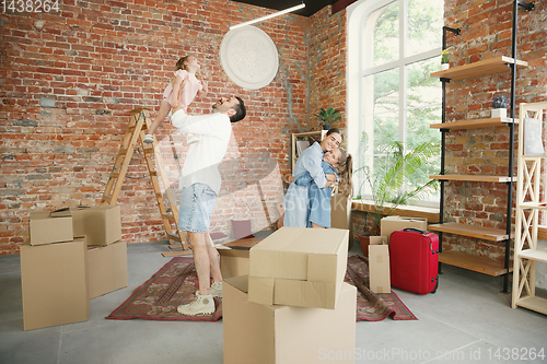 Image of Adult family moved to a new house or apartment