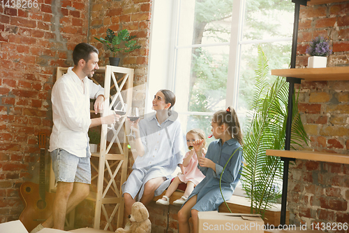 Image of Adult family moved to a new house or apartment