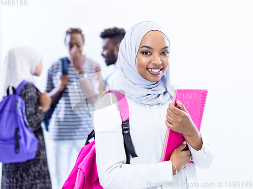 Image of portrait of african female student with group of friends