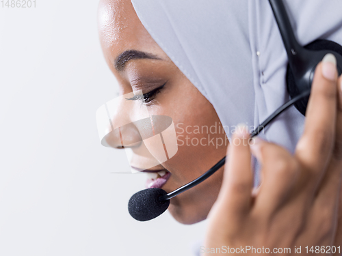 Image of african customer representative business woman with phone headse