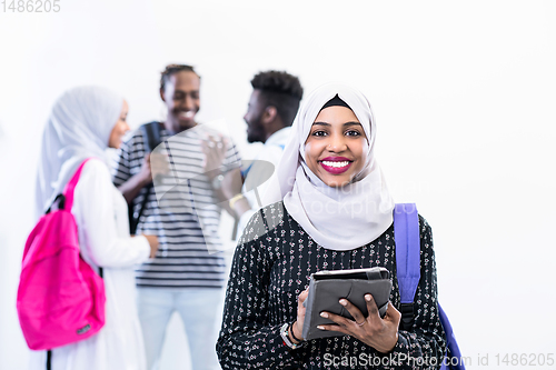 Image of muslim female student with group of friends