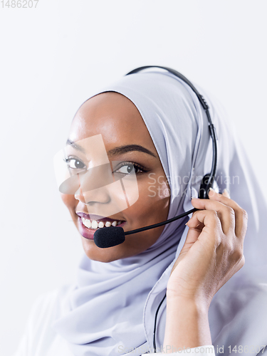 Image of african customer representative business woman with phone headse