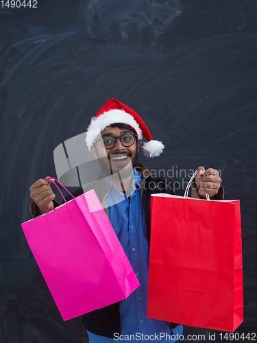 Image of Indian Santa with shopping bags