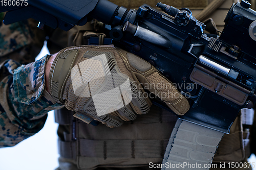 Image of soldier preparing gear for action