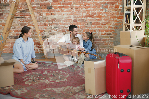 Image of Adult family moved to a new house or apartment