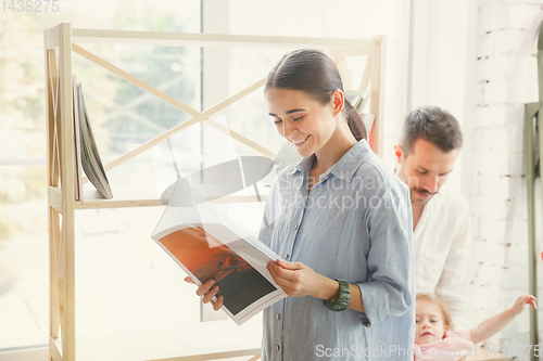 Image of Adult family moved to a new house or apartment