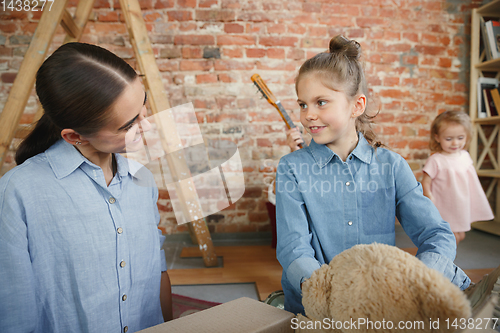 Image of Adult family moved to a new house or apartment