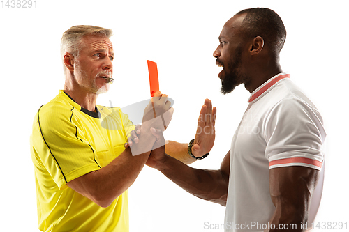 Image of Football referee showing a red card to a displeased player isolated on white background