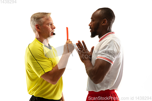 Image of Football referee showing a red card to a displeased player isolated on white background