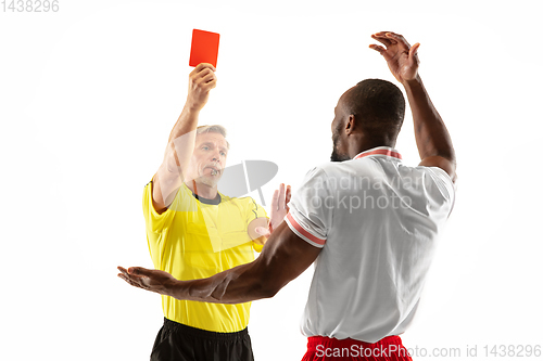 Image of Football referee showing a red card to a displeased player isolated on white background