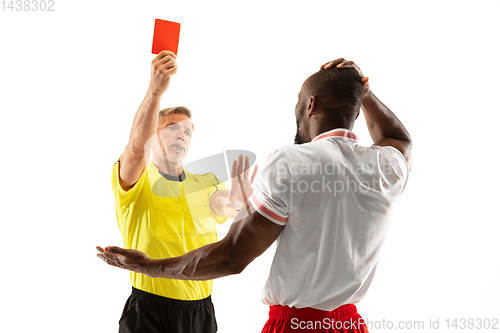 Image of Football referee showing a red card to a displeased player isolated on white background