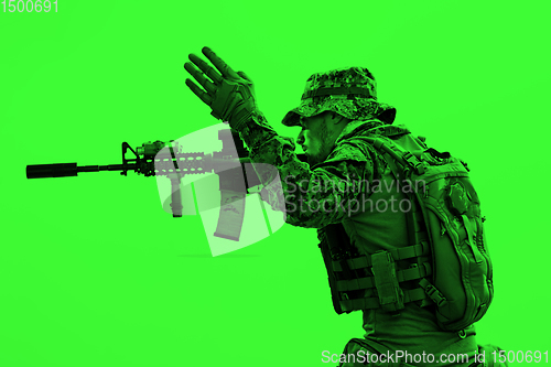 Image of soldier in action aiming laseer sight optics