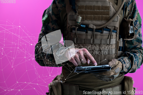 Image of soldier using tablet computer closeup pixelated