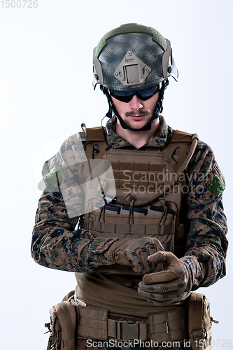 Image of closeup of soldier hands putting protective battle gloves