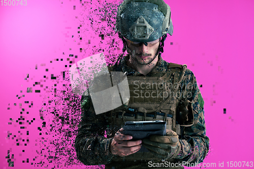 Image of soldier using tablet computer closeup pixelated