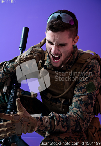 Image of soldier  checking communication