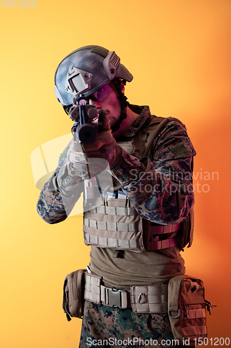 Image of modern soldier against yellow background