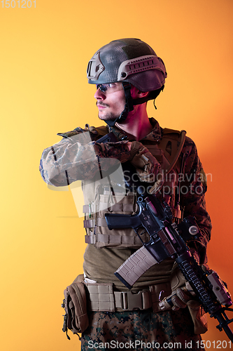 Image of modern soldier against yellow background