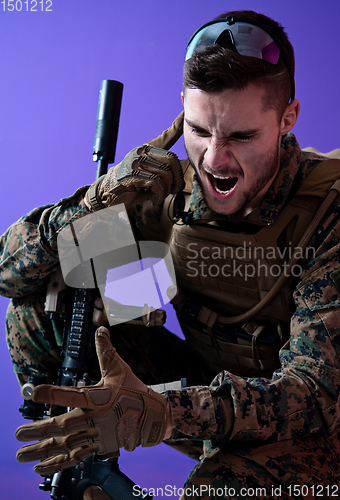 Image of soldier  checking communication