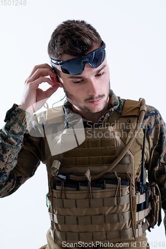 Image of soldier preparing gear for action