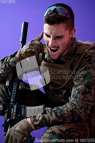 Image of soldier  checking communication