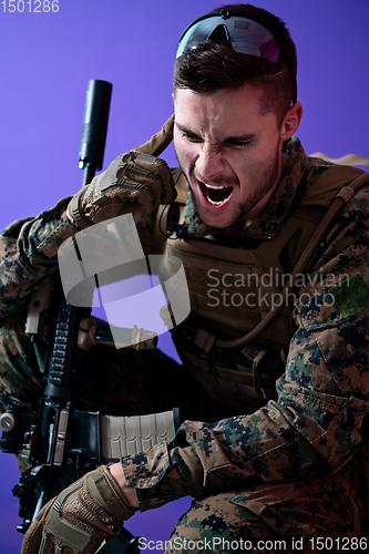 Image of soldier  checking communication