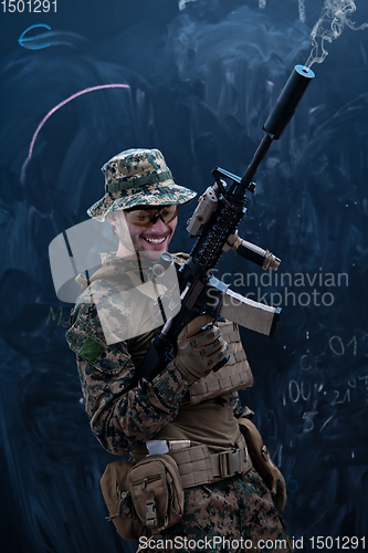 Image of soldier firing into the air in front of black chalkboard