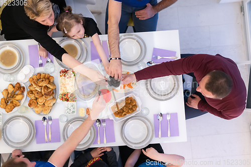 Image of iftar dinner muslim family together during a ramadan feast at ho